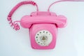 Pink telephone on a white background Royalty Free Stock Photo