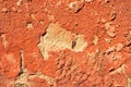 Pink flaky stucco and cement on outer wall of a building. Grunge wall texture for design. The old paint texture breaks off and Royalty Free Stock Photo