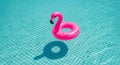 Pink Flamingo Pool Float in Blue Water Royalty Free Stock Photo