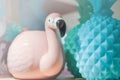 Pink flamingos, blue pineapple. ceramic objects in pastel colors