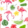 Pink flamingos, jungle leaves and tropical flowers seamless pattern