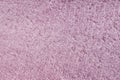 Pink fleecy synthetic fabric textile background. Soft plush fluffy cloth texture Royalty Free Stock Photo