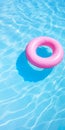 Pink floatie Inflatable doughnut in a pool, and clear blue water blue water, chill, tanning under sun.