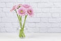 Pink floral bouquet isolated on white brick background Royalty Free Stock Photo