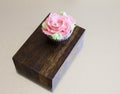 Pink Floral Cupcake on wood and metal Royalty Free Stock Photo