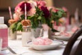 Pink flower design on the served restaurant table for Sunday girly brunch party Royalty Free Stock Photo