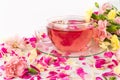 Pink Flower Tea with Carnation Petals. Hot Rose Drink in Glass Cup Royalty Free Stock Photo