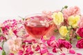 Pink Flower Tea with Carnation Petals. Hot Rose Drink in Glass Cup Royalty Free Stock Photo