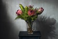 Pink flowers in bottle in loft interior Royalty Free Stock Photo