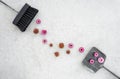 Pink flowers, brush and dustpan on concrete floor Royalty Free Stock Photo