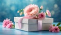 Pink flowers in gift box on blue background. Mothers day, Anniversary, Womens Day gift concept