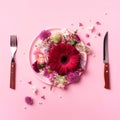 Pink flowers on pink plate, fork, knife over punchy pastel background. Healthy eating, vegan diet concept. Creative layout. Top Royalty Free Stock Photo