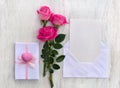 Pink flowers roses, postal envelope with paper card note with space for text, gift box with pink heart Royalty Free Stock Photo