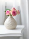 Pink flowers in white vase