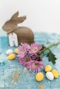 Pink flowers and yellow and white colored easter eggs, and easter bunny Royalty Free Stock Photo