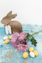 Pink flowers and yellow and white colored easter eggs, and easter bunny Royalty Free Stock Photo