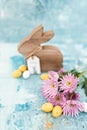 Pink flowers and yellow and white colored easter eggs, and easter bunny Royalty Free Stock Photo