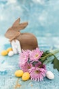 Pink flowers and yellow and white colored easter eggs, and easter bunny Royalty Free Stock Photo