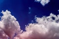 Pink fluffy cloud against the blue sky like sugar strawberry vanilla cotton, concept of dreams, pink dreams and hopes, first love Royalty Free Stock Photo