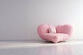 Pink fluffy huge sofa in the shape of a chubby heart.