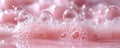 Pink foam bubbles creating a textured surface