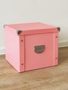 Pink folding storage box made of durable cardboard for storing papers, documents