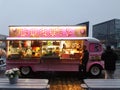 Pink food truck offering donuts and waffles at the Albert Dock waterfront in Liverpool,Great Britain