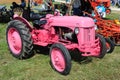 Pink Ford antique farming tractor.