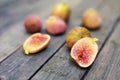 Pink fresh figs on the old wooden table