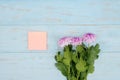 Pink gerbera flower and empty post it