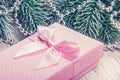 Pink gift box with bow close-up. Christmas or New Year gift