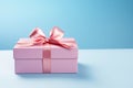 Pink gift box with pink bow isolated on blue background, New year and Valentine present promotion offer concept. Generative AI