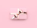 Pink gift box christmas holiday new year concept metallic pink glossy reflection ribbon bow minimal pink background 3d render Royalty Free Stock Photo
