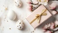 A pink gift box with a gold bow and white eggs symbolizes Easter celebrations and spring joy. Royalty Free Stock Photo