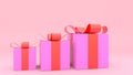 Pink gift box with red ribbon on pink background Royalty Free Stock Photo