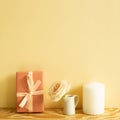 Pink gift box, rose flower, candle on wooden table Royalty Free Stock Photo