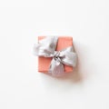 Pink gift box with silver ribbon isolated on white background Royalty Free Stock Photo