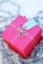 Pink Gift box with a silver ribbon and tag Royalty Free Stock Photo