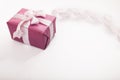 Pink gift box white bow long curved ribbon and empty space for text on white background