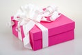 Pink gift box with white ribbon and bow Royalty Free Stock Photo