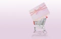 Pink gift boxes on 4 wheel trolley shopping cart Royalty Free Stock Photo