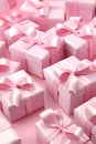 Pink gift group with ribbons on pink background.