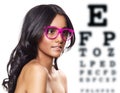 Pink glasses on beautiful tanned woman. Royalty Free Stock Photo