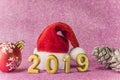 Pink glitter background for New Year`s Cards with a Christmas ha