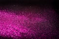 Pink glitter on black backgrund with copy space Royalty Free Stock Photo