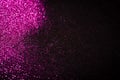 Pink glitter on black backgrund with copy space Royalty Free Stock Photo