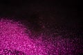 Pink glitter on black backgrund with copy space Royalty Free Stock Photo