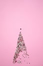 Pink glitter fir tree icon with star, shining glowing twinkled sparkled textured object, Christmas and New Year invitation and