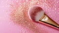 Rose Gold Makeup Brush With Glitter on Pink Background Royalty Free Stock Photo