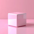 Pink Glossy Cube on Pink Reflective Surface Royalty Free Stock Photo